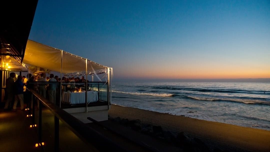The oceanfront deck at Pacific Coast Grill at sunset